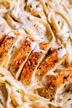 chicken alfredo with parmesan sauce in a pan