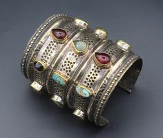 Afghan traditional alpaka long cuff bracelet. Its %100 hand crafted workmanship with beautiful colorful Gemstones and lovely shape. This bracelet is adjustable to your wrist perfectly. Please do not hesitate to contact if you have any questions. * Weight : 194.9 grams, * Inner circumference : 17cm ( 6.7" ) * Width : 8.6cm ( 3.4" ) Shipping & Estimated Delivery Time With Turkish Registered Post, Destination CountryStandard Shipping (business days) United States          15-20  Europe7-15 Asia15-2 Artisan Cuff Bracelet As Festival Gift, Artisan Bangle As Festival Gift, Bohemian Cuff Bracelet For Festivals Gift, Bohemian Multi-stone Bangle Jewelry, Bohemian Multi-stone Bangle, Unique Multi-stone Cuff Bracelet Gift, Unique Multi-stone Cuff Bracelet As A Gift, Unique Cuff Bracelet As Festival Gift, Unique Cuff Bracelet For Festivals As A Gift