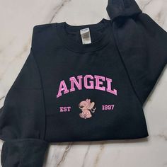 Introducing our Stitch and Angel Embroidered Sweatshirt, a delightful addition to your wardrobe! This sweatshirt features intricate embroidery of everyone’s