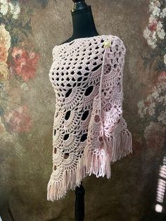 This listing is for one handmade crocheted shawl in pale pink.  Shawl measures approximately  70 inches across and 35 inches long.  Made from 100% acrylic yarn.  Comes with a gold tone heart pearl pin.  Super soft and warm!  Thank you so much for looking! Please check out my shop for more one of a kind handmade gifts. Pink Crochet Shawl One Size, Pink Crochet Lace Shawl In Bohemian Style, Bohemian Pink Shawl With Crochet Lace, Pink Bohemian Shawl With Crochet Lace, Crocheted Shawl, Pink Shawl, Crochet Pink, Shawl Crochet, Crochet Fringe