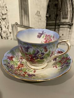 a cup and saucer on a table