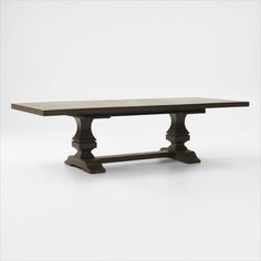 a wooden table with two legs and a long slab on one end, against a white background