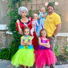 two adults and three children dressed up in costumes