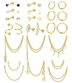 a collection of different types of piercings on a white background with chains and stars