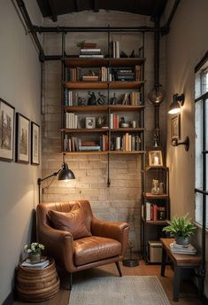 a living room with a leather chair and bookshelf on the wall next to a window