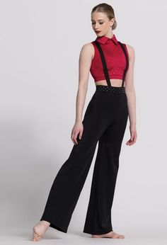 a woman in black pants and a red top