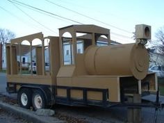 a large brown truck is parked on the side of the road