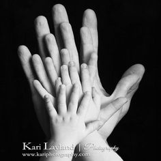 several hands reaching up into the air