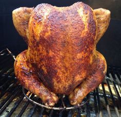 a roasted chicken is on the grill with it's head turned to look like an animal