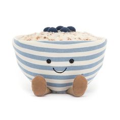 a blue and white striped bowl with a smiling face