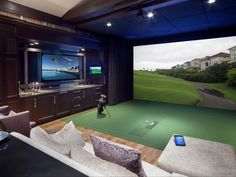 a living room filled with furniture and a flat screen tv mounted to the side of a wall