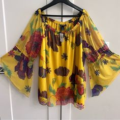 This Floral Blouse Reminds Me Of Flower Power. The Colors Are Very Vibrant And Beautiful. The Top Measures Pit To Pit 29 Inches And Has A Length Of 27 Inches. Vibrant Yellow Floral Print Tops, Cheap Yellow Floral Print T-shirt, Yellow Floral Print Cotton T-shirt, Cheap Multicolor Floral Print T-shirt, Black Leather Shorts, Multicolor Long Sleeve Floral Print T-shirt, Black Lace Blouse, Dolman Sleeve Tops, Yellow Top