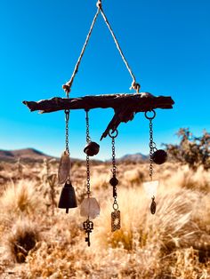 an old wind chime hanging in the desert