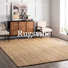 rugs and chairs in a room with white walls