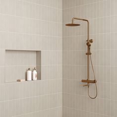 the shower head and hand held shower faucet are shown in this bathroom