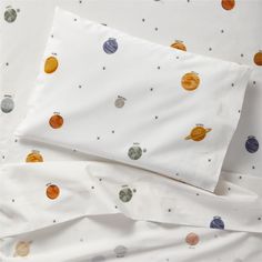 an image of a bed with planets on it