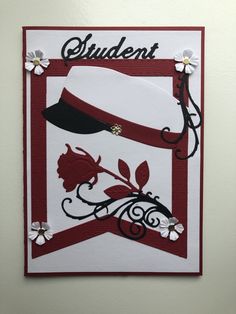 a red and white card with a hat on it's side that says student