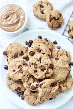 chocolate chip cookies and peanut butter on a white plate