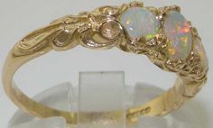 an opal and diamond ring is on display