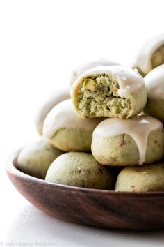 a bowl filled with cookies covered in frosting