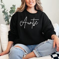 This trendy Auntie Heart Sweatshirt is more than just a stylish fashion statement - it's also cozy and soft, perfect for any aunt on the go. Show off your love for your nieces and nephews while staying comfortable all day long. Bring your aunt game to the next level with this must-have sweater. Heart Sweatshirt, Heart Sweater, Niece And Nephew, Stylish Fashion, Black Media, Black Sweaters, Next Level, Fashion Statement, The Go