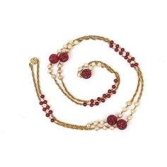 This fabulous long vintage Chanel sautoir necklace has red gripoix glass beads, faux pearls interspersed along the gold metal link chain. The red glass beads are 2 different sizes. It can wrap 2 or 3 times over on your neck or you can stagger it. It is marked Made in France Chanel 1984. it comes in a Chanel box and belonged to a big Chanel collector who may have worn this necklace once. It is 35" long or high when closed and opened up 68" L. The size of the big red glass fluted bead balls are 1/ Elegant Red Long Necklace With Round Beads, Vintage Red Chain Necklace, Elegant Red Long Necklace, Vintage Red Single Strand Jewelry, Red Round Bead Evening Jewelry, Red Round Beads Evening Jewelry, Vintage Long Beaded Necklaces For Formal Occasions, Red Round Beads Jewelry For Evening, Red Beaded Evening Jewelry