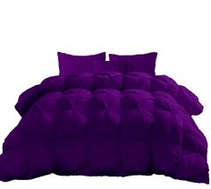 a bed with purple comforter and pillows on top of it, in front of a white background