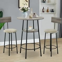 three stools and a table in a room