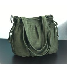 Please check 'shop announcement' for production time and delivery before your purchase.  This gorgeous bag is made from forest green pure hemp material. I really love its unique texture and the ruggedness of hemp, giving you a different feeling from other kinds of fabric. 12.5" top wide 12.5" tall 3.5" deep 23" straps This everyday bag is sturdy and roomy enough to hold your essentials, such as books, wallet, iPad, mobile and keys. It's fully lined with canvas, there are 2 slip pockets, one zipp Green Canvas Bag With Double Handle For Daily Use, Green Canvas Bag For Daily Use, Green Satchel Canvas Bag For Everyday, Eco-friendly Shoulder Bag With Rolled Handles, Eco-friendly Hobo Bag For Everyday, Green Shoulder Bag With Rolled Handles For Travel, Eco-friendly Khaki Shoulder Bag For Travel, Green Satchel Bag With Rolled Handles, Handmade Green Hobo Bag For Daily Use