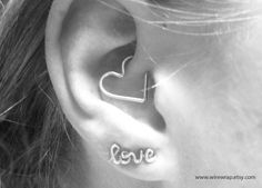 an ear with the word love written on it