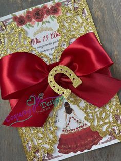 a red and gold birthday card with a number 2 on it's front bow