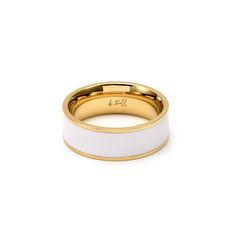 a white and gold wedding ring with an inscription on the inside, in front of a white background