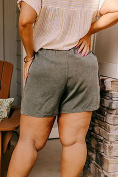 - Keep it casual in these trendy shorts! - Lightweight unlined material - A high elastic waistline with a faux drawstring accent tie - A faux zip fly accent - Functional side pockets as well functional low cargo style pockets - A relaxed silhouette that ends in straight mid-thigh length hemlines Measurements XL : Front Rise 17", Hip 42", Inseam 3.5", Length 17.5", Waist 36-40". 1XL : Front Rise 17", Hip 44", Inseam 4", Length 18", Waist 38-42". 2XL : Front Rise 17.5", Hip 46", Inseam 4.5", Lengt Khaki Drawstring Bottoms Of Short Length, Khaki Drawstring Bottoms Short Length, Khaki Short-length Bottoms With Drawstring, Khaki Drawstring Shorts, Casual Olive Bottoms Short Length, Casual Olive Short Bottoms, Casual Olive Short Length Bottoms, High Waist Shorts, Cargo Style