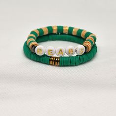 Custom to fit your wrist, this bracelet set is made to order in your size. Select your style (if you like to stack, both sets look great together). Each set comes with 2 bracelets as shown in the photos.  Let the world know that you or someone you love is or was a Baylor student. Adjustable Stacked Bracelets As Gift, Adjustable Stackable Bracelet Wristband, Adjustable Stackable Wristband Bracelet, Customized Adjustable Green Bracelets, Customized Adjustable Green Bracelet, Customized Adjustable Green Beaded Bracelets, Adjustable Customized Green Bracelets, Trendy Double Band Bracelets As Gift, Trendy Double Band Bracelets For Gifts