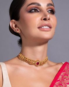 * 24K Gold Plated Handcrafted Intricate Choker Jewellery Set * Gold plated necklace, has a drawstring closure * Gold plated earrings, has a post and back closure * Size:- Necklace length: 25.3 cm Earrings length: 1.6 cm(each) *Material:- Material: Brass Plating: Gold-Plated Stone Type: CZ, Ruby stones and beads NOTE All the raw material used in this product is of high quality and is handcrafted with love. Premium Quality and High craftsmanship 100% Satisfaction Guarantee: Long Lasting Plating, H Ruby Choker Necklace, Ruby Choker, Guttapusalu Necklace, Indian Jewelry Set, Indian Choker, Indian Choker Necklace, Choker Necklace Designs, Antique Gold Jewelry Indian, Gold Necklace Indian