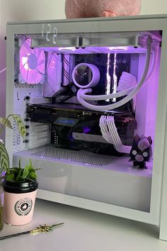 there is a small computer in the case with purple lights on it's sides