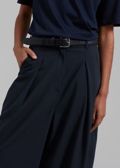 Color: Navy Midweight wool blend fabric Wide leg Front pleated detailing Slant hip pockets Back patch pockets Zip fly Hook and bar closure Unlined 60% Polyester 20% Wool 16% Rayon 2% Polyurethane Dry Clean By The Frankie Shop. Imported Leather Workwear Bottoms With Pockets, Navy Wide Leg Pants With Belt Loops, Leather Tapered Leg Pants For Work, Navy Bottoms With Welt Pockets For Work, Navy Pants With Welt Pockets For Workwear, Navy Bottoms With Belt Loops For Business Casual, Casual Leather Bottoms For Work, Leather Pants With Belt Loops For Work, Formal Leather Pants With Belt Loops