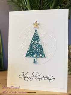 a card with a christmas tree on it