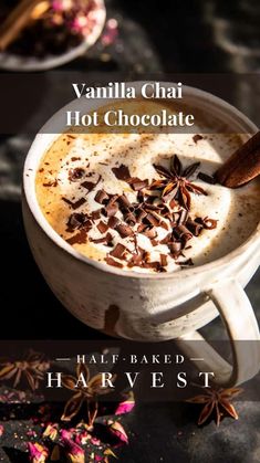 a cup of hot chocolate with cinnamon and star anise on top