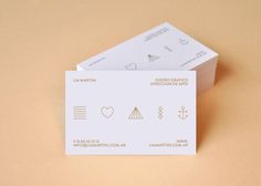 two business cards sitting on top of each other