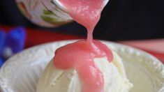 a bowl filled with ice cream sitting on top of a table