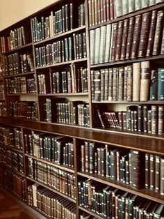 the bookshelf is full of many different types of books on it's shelves