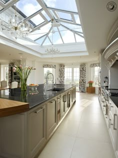 a large kitchen with an island and skylight