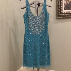 Sleeveless Beaded Blue Cocktail Dress. Never Been Worn. Blue Fitted Dresses With Beaded Straps, Fitted Blue Dress With Beaded Straps, Sleeveless Beaded Strap Cocktail Dress, Sleeveless Cocktail Dress With Beaded Straps, Sleeveless Embellished Mini Dress For Prom, Embellished Sleeveless Mini Dress For Prom, Embellished Fitted Sleeveless Prom Dress, Blue Party Dress With Beaded Straps, Blue Fitted Sleeveless Dress For Prom Season