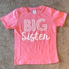 Sweet Big Sister T-Shirt In Pink. Short Sleeves. Very Cute! A Great Way To Announce That The Newest Member Of The Family Has Arrived. Size: 5 (Tag Says 5y. Fits Like A 5t.) Color: Pink Fabric: 95% Cotton, 5% Spandex Condition: New In Bag, Never Worn (Was Part Of A Two-Piece Set And We Only Used The Infant’s T-Shirt.) Big Sister T Shirt, Big Sister, Pink Fabric, Kids Shirts, The Family, Shirts Tops, Kids Shop, Two Piece, Short Sleeves