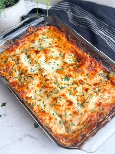 a casserole dish with cheese and herbs