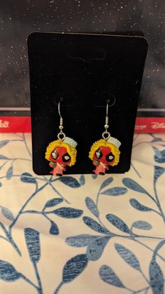 These are Funko Bitty Pops turned into earrings.  They still fit in their box and can be worn with or without the base on them.    (the base does have a very tiny screw that holds it on the Bitty Pop!. They weigh approximately 2 grams each without the base and 3 grams with the base.  Each purchase is for 1 pair.  Matching Characters. Themed Red Earrings, Themed Dangle Pierced Earrings, Themed Earrings For Pierced Ears As Gift, Themed Pierced Earrings As A Gift, Themed Gift Earrings, Themed Dangle Earrings, Themed Drop Earrings For Gifts, Nickel-free Themed Dangle Earrings, Themed Dangle Earrings For Gifts