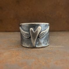 Sterling Silver Rustic Wild Prairie Ring Sterling Silver Ring Handmade Wild Prairie Silver Sterling Silver Rustic every day wear Wild Prairie Ring. I love this as a thumb ring! Handmade with love in rural Wisconsin by Wild Prairie Silver Follow Us: Instagram: https://www.instagram.com/wildprairiesilver/ Facebook: https://www.facebook.com/wildprairiesilver/ Visit our Jewelry Website www.wildprairiesilver.com Handmade Jewelry Supplies www.savannahjewelrysupply.com Contact Us: Call or Text: 920-365 Sterling Silver Thick Band Promise Ring, Wide Band Ring With Polished Finish For Promise, Promise Ring With Polished Finish And Wide Band, Hand Forged Thick Band Wide Ring, Hand Forged Wide Band Ring As Gift, Hand Forged Wide Band Ring For Gift, Hand Forged Wide Band Ring For Anniversary, Hand Forged Wide Band Open Ring For Anniversary, Symbolic Hand Forged Promise Ring