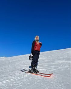 a woman standing on skis in the snow