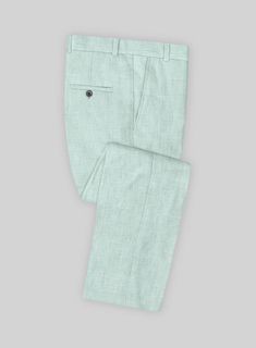 Mint adds a refreshing touch to any outfit, and our Italian Linen Mint Green Pants allow you to incorporate this color from head to toe for a cool and stylish look. Crafted from pure, lightweight, soft, and breathable linen, these striking pants boast a solid texture and a pastel mint green hue with subtle hints of blue, making you stand out on any occasion, from a summer wedding to a horse racing event.   Look Includes   Italian Linen Mint Green Fabric  Cross Pocket  Flat Front  Two Welted Bac Summer Solid Dress Pants With Welt Pockets, Solid Summer Dress Pants With Welt Pockets, Tailored Summer Dress Pants With Pockets, Summer Tailored Dress Pants With Pockets, Tailored Dress Pants With Pockets For Summer, Tailored Solid Pants For Summer, Green Dress Pants With Welt Pockets For Spring, Summer Cotton Dress Pants, Linen Dress Pants Trousers For Summer